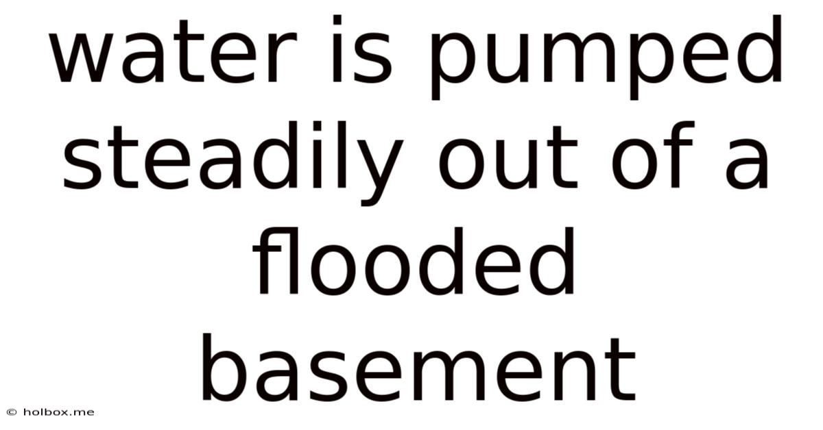 Water Is Pumped Steadily Out Of A Flooded Basement